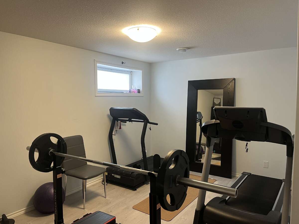 Second lower level bedroom, presently a home gym.