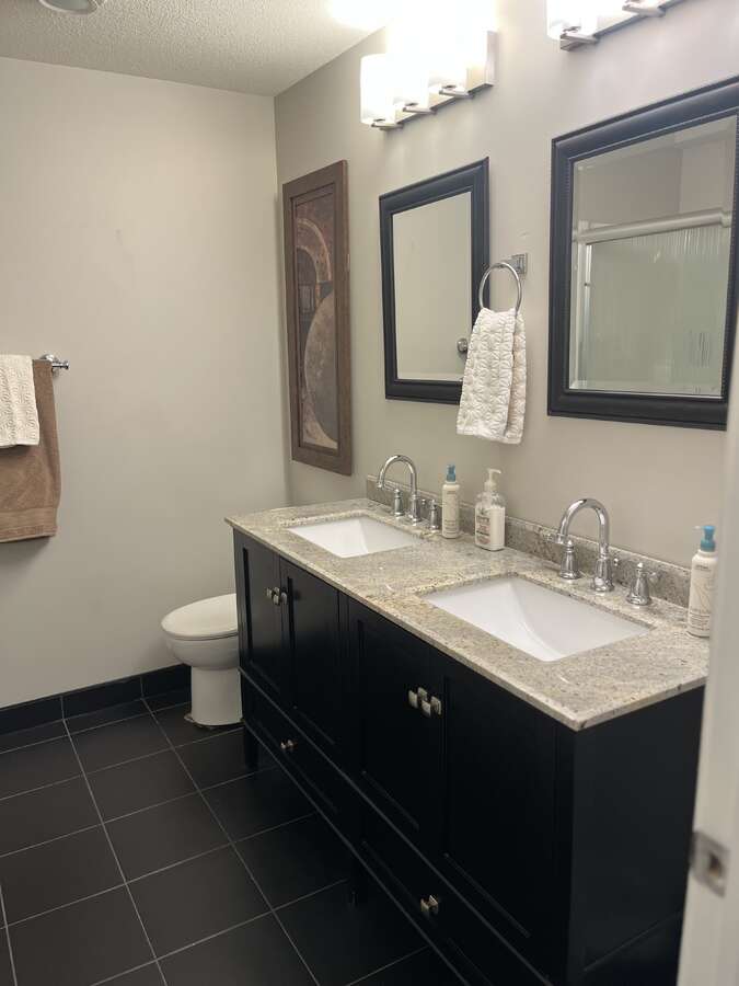 Lower level bathroom with double sink