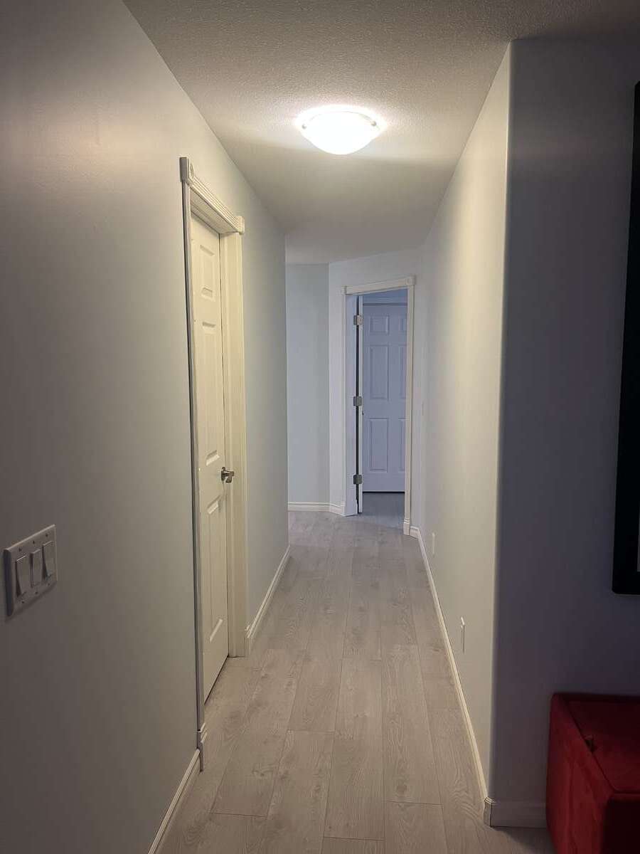 Hallway to second and third lower level bedrooms and maintenance room