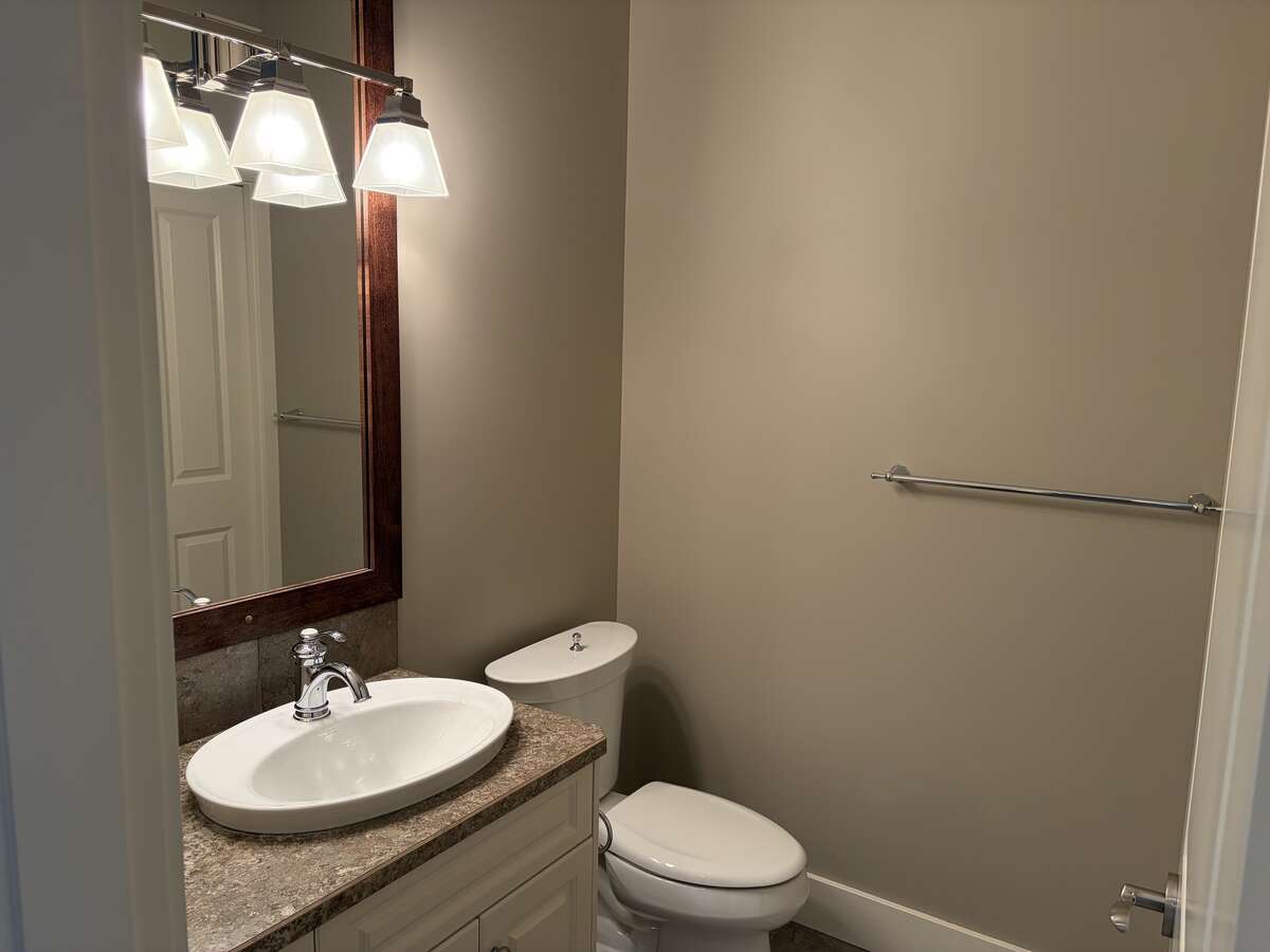 Main bathroom with stand up shower and linen closet.