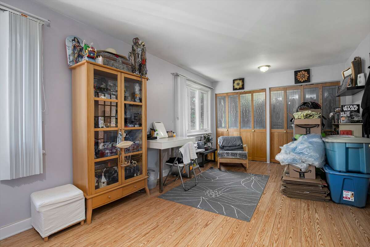 Master bedroom with wall to wall stainglass closet, 2 larges windows
