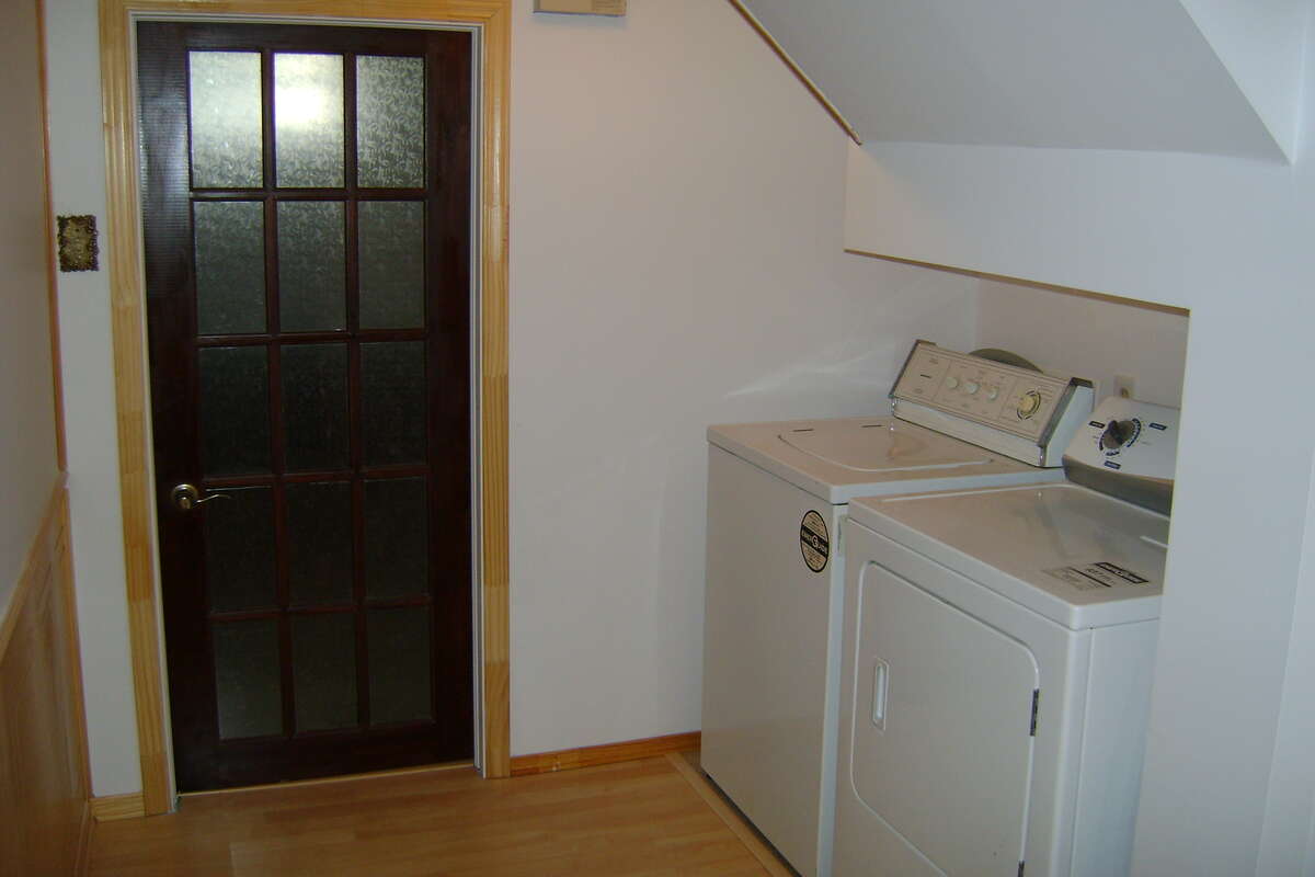 From side door landing to basement