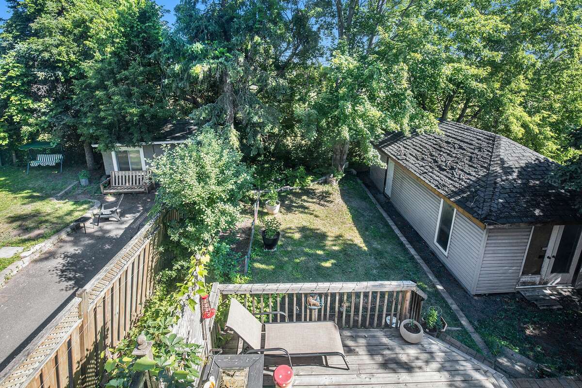 Backyard from Master Bedroom - the garage is on ciment Foundation and could be converted into a tiny home accommodation or office space/workshop (Roof Shed currently covered with all season tarp)
