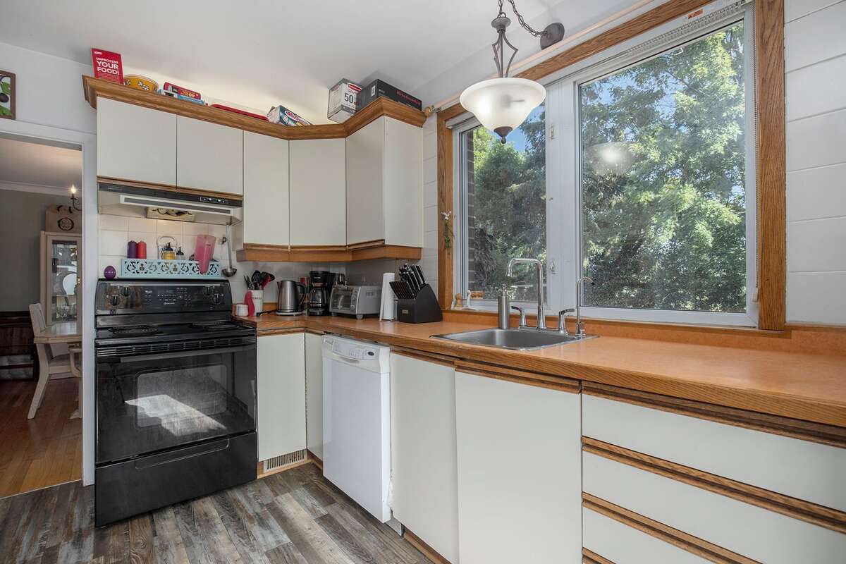 Main Floor eat-in kitchen opening onto dinning room