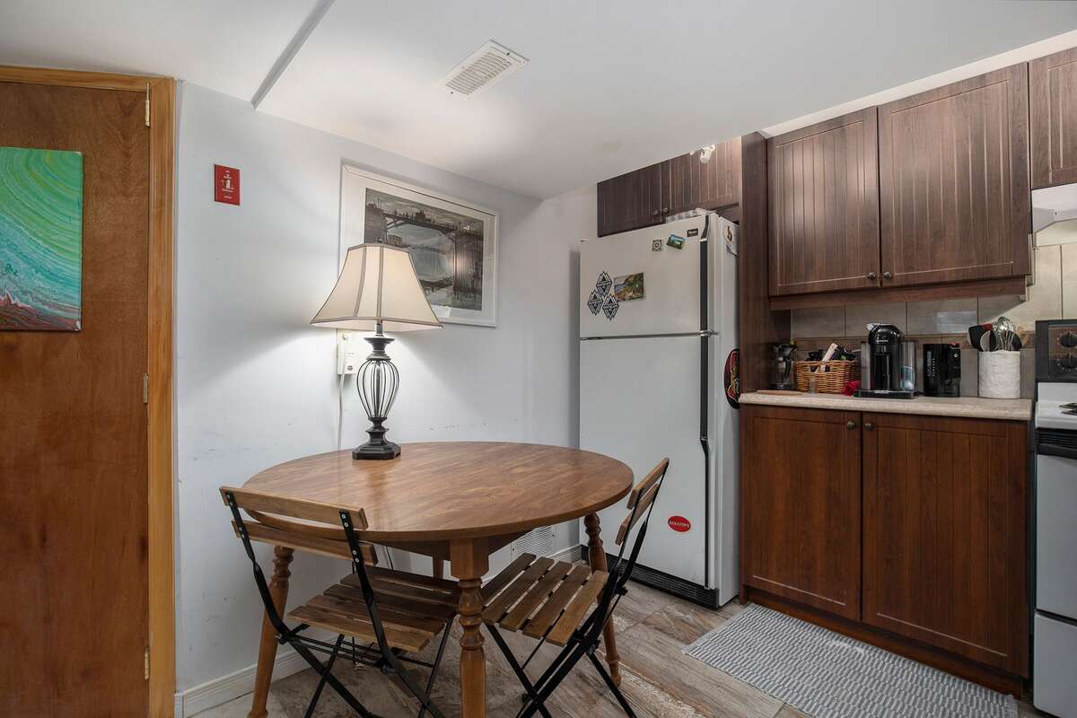 Basement suite kitchenette, appliances included (refridgerator, self and easy-clean stove, deshumidifier draining automatically into the well, microwave)