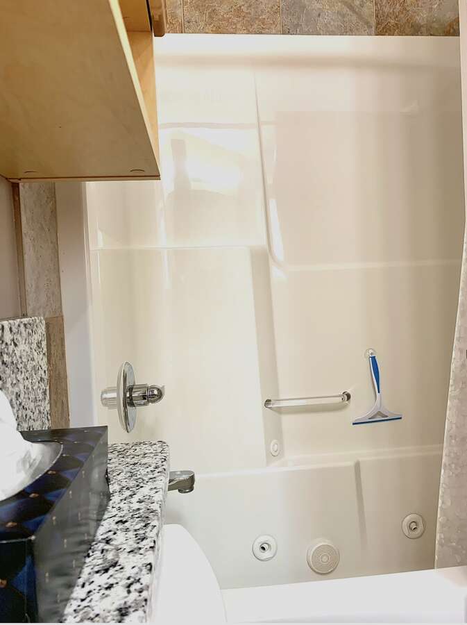 Primary Ensuite Shower with Jetted Tub.