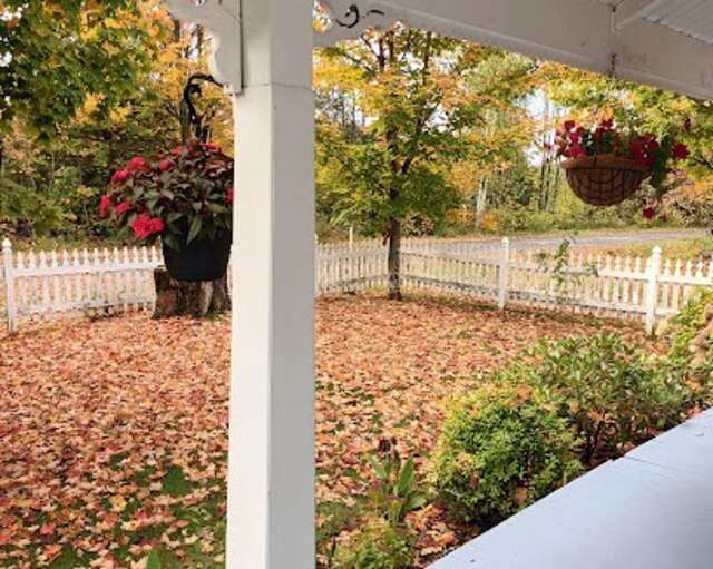 Side yard with white picket fence