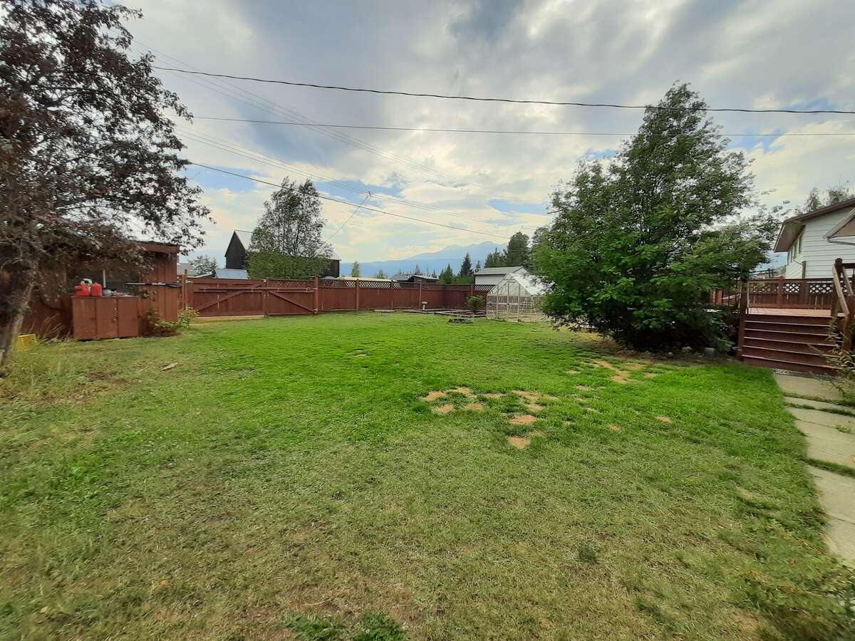 Fenced yard viewing south-west