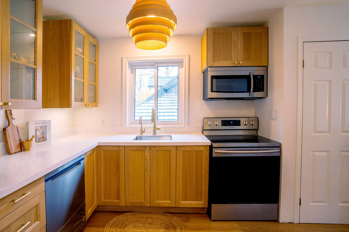 Beautiful white oak kitchen with stone countertops