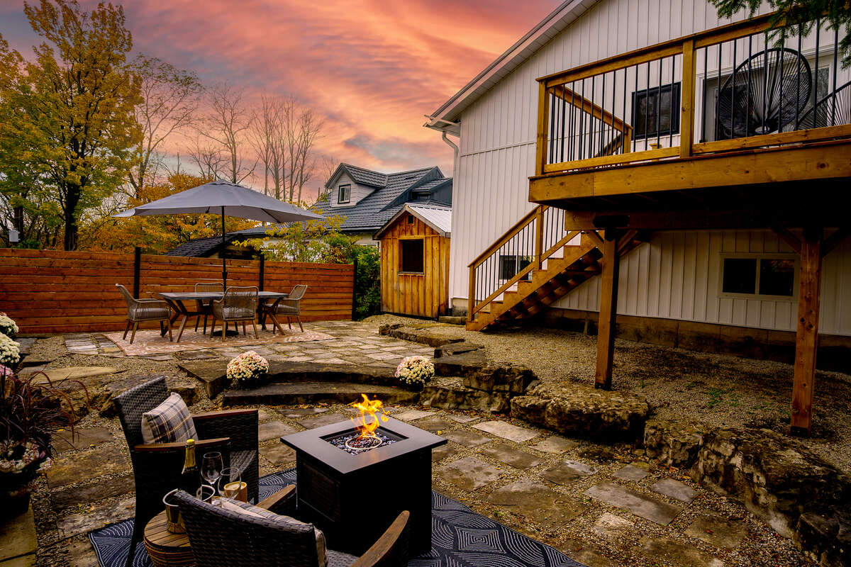 Natural stone oasis in this professionally landscaped backyard