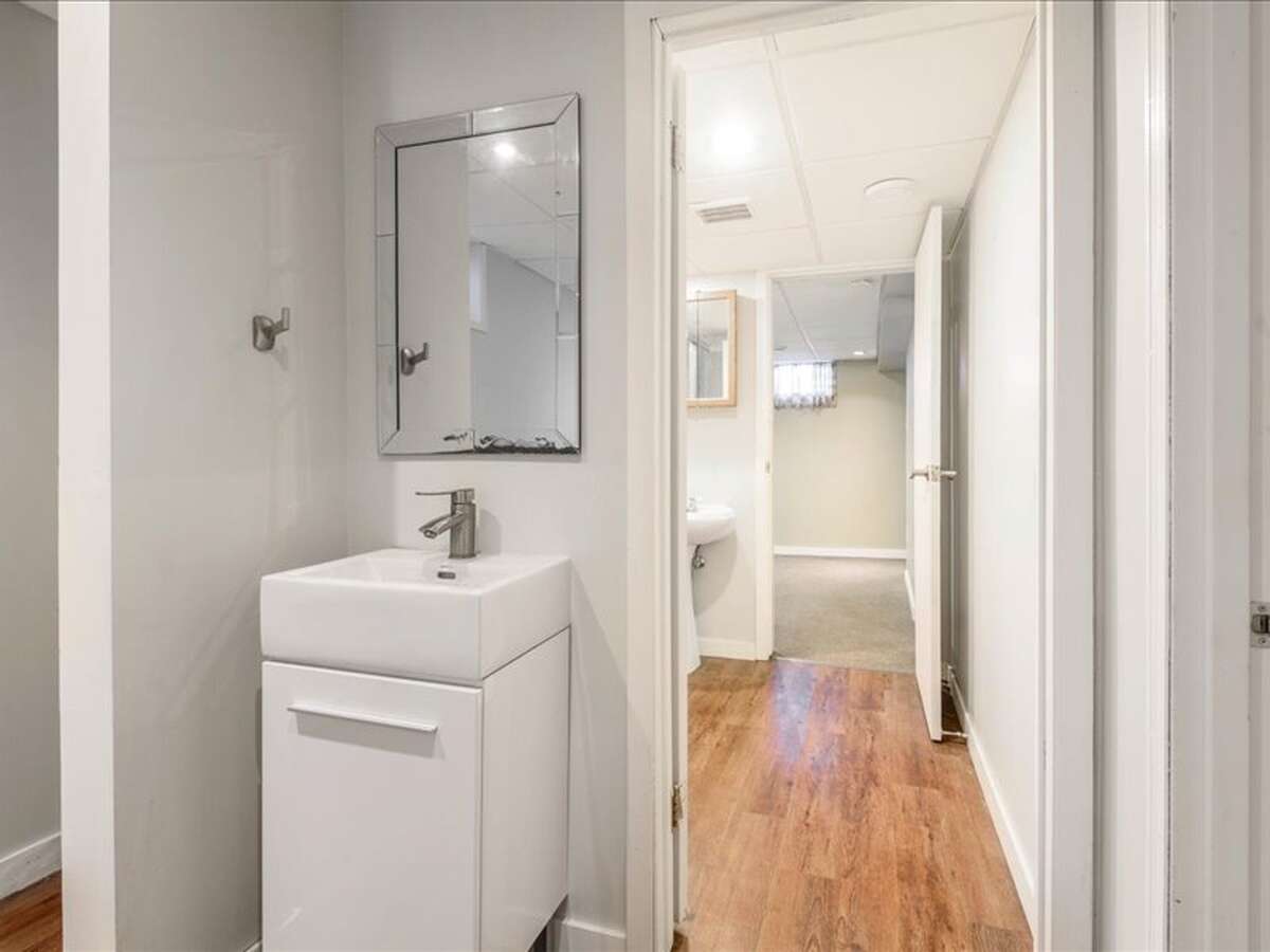 Basement Bedroom: Originally used as registered Massage Clinic, Vinyl Plank Flooring, Drop Ceiling