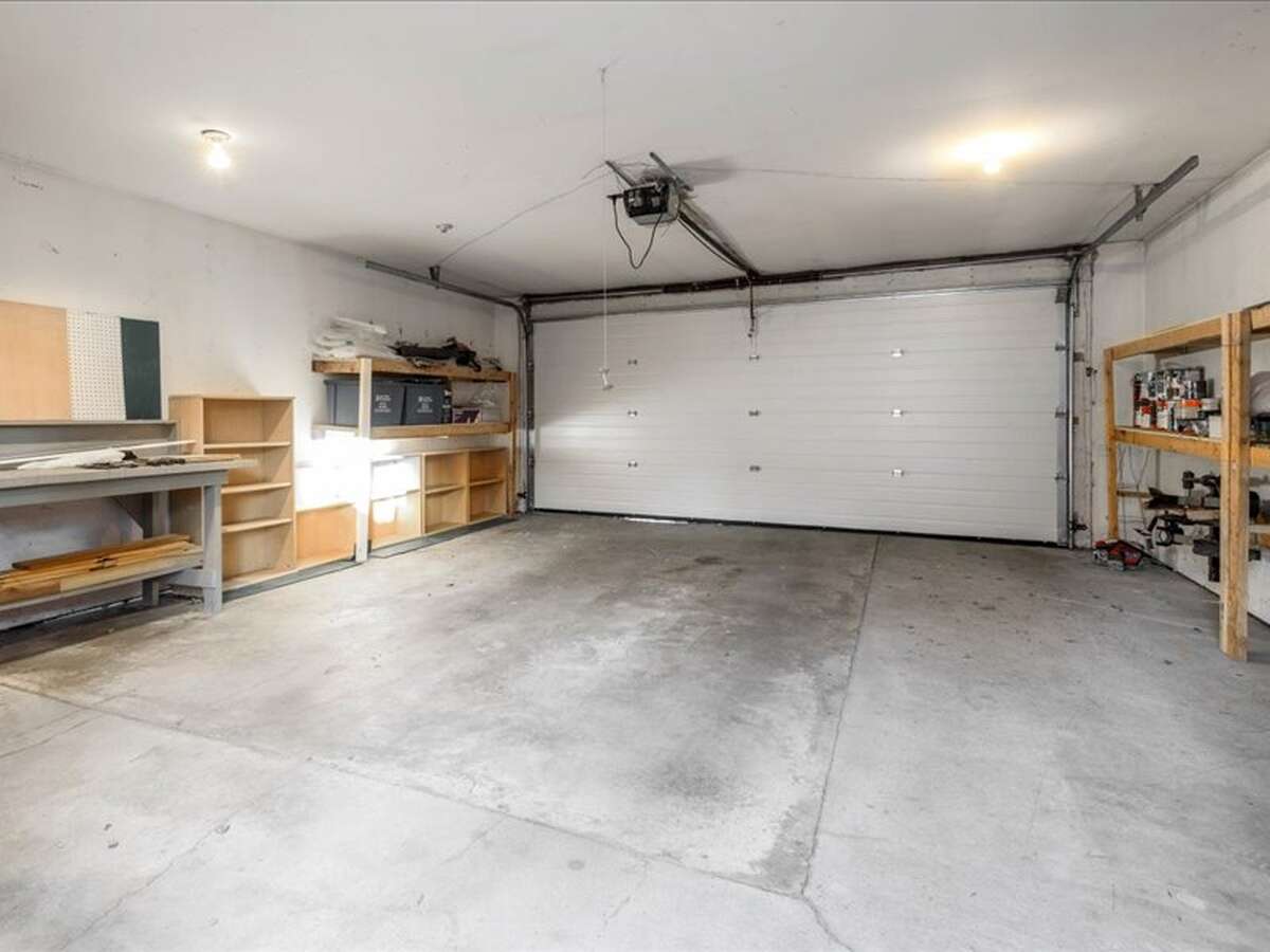 2 Car, Insulated, Electrified Garage, Overhead Garage Door Opener, Custom Built Shelving, Workbench