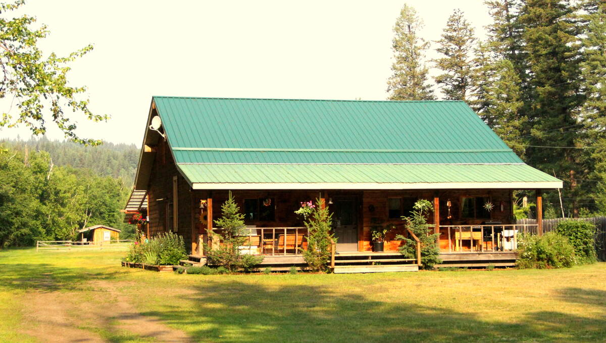House with front covered porch from driveway entrance