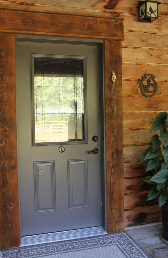 Front door and large country porch