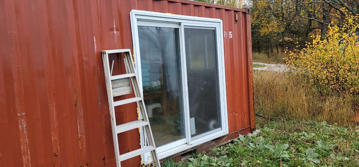 Sea can sliding door