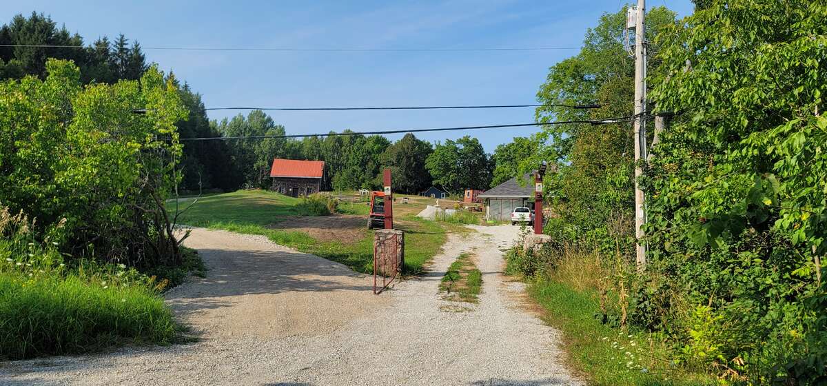 Entrance driveway left to cottage right to Main House