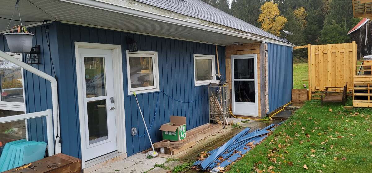 Back of house with small attached shed