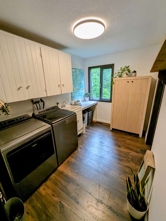Laundry on main floor - beside hot tub entry