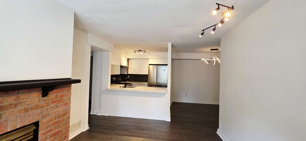 Gas fireplace in the living room for ambience or extra heat; new floors & paint all throughout