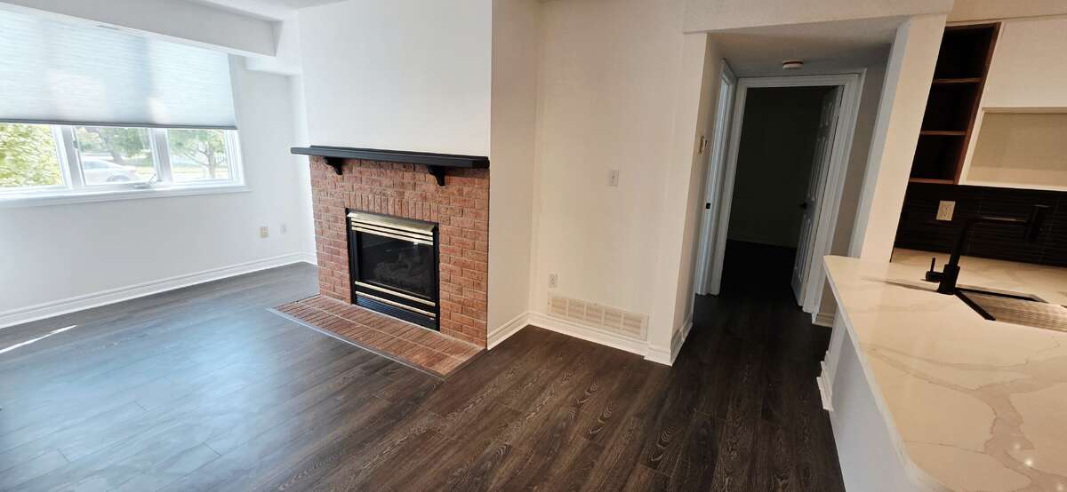 Hallway leading to 2 bedrooms and a full bathroom; one bedroom can be used as a study or home office