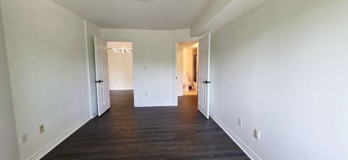 Primary bedroom view 2: R door to ensuite bath and W-I closet; L door to Dining
