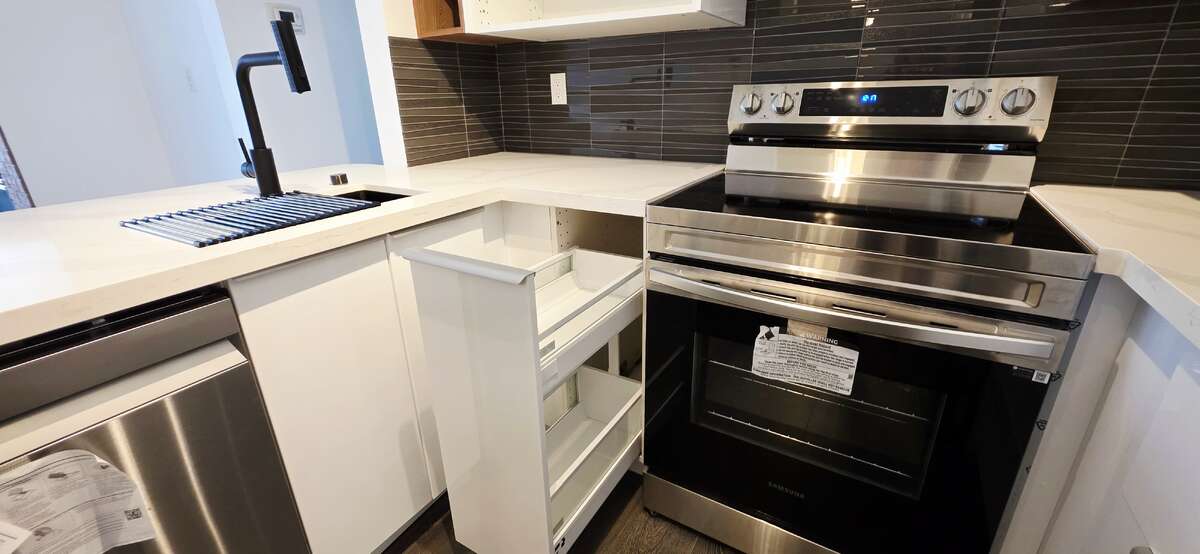 Easy access to pull-out drawers for spices, cans, bottles & other cooking essentials