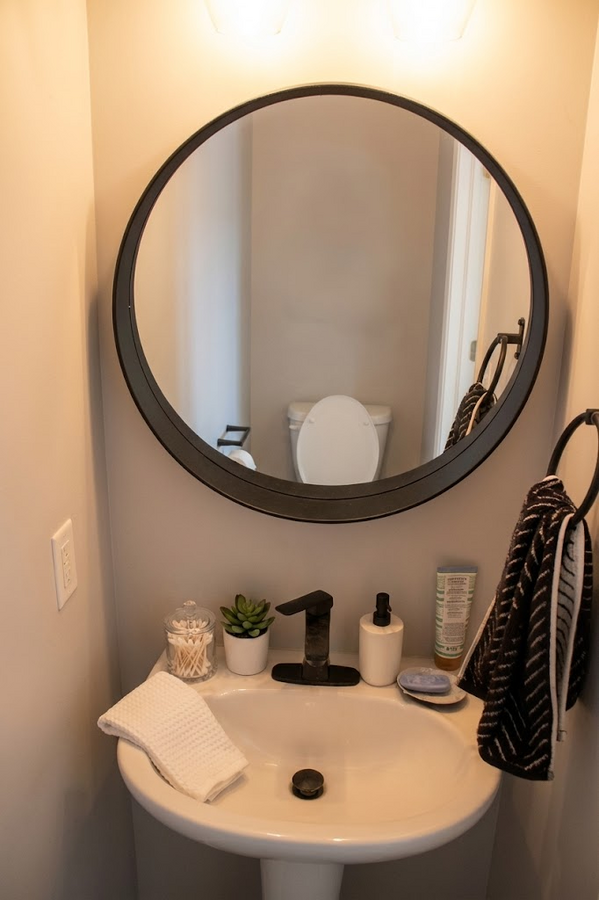Powder room on the main floor with toilet seat.