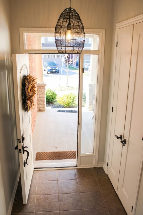 Foyer entrance featuring hanging lights, plenty of natural light.