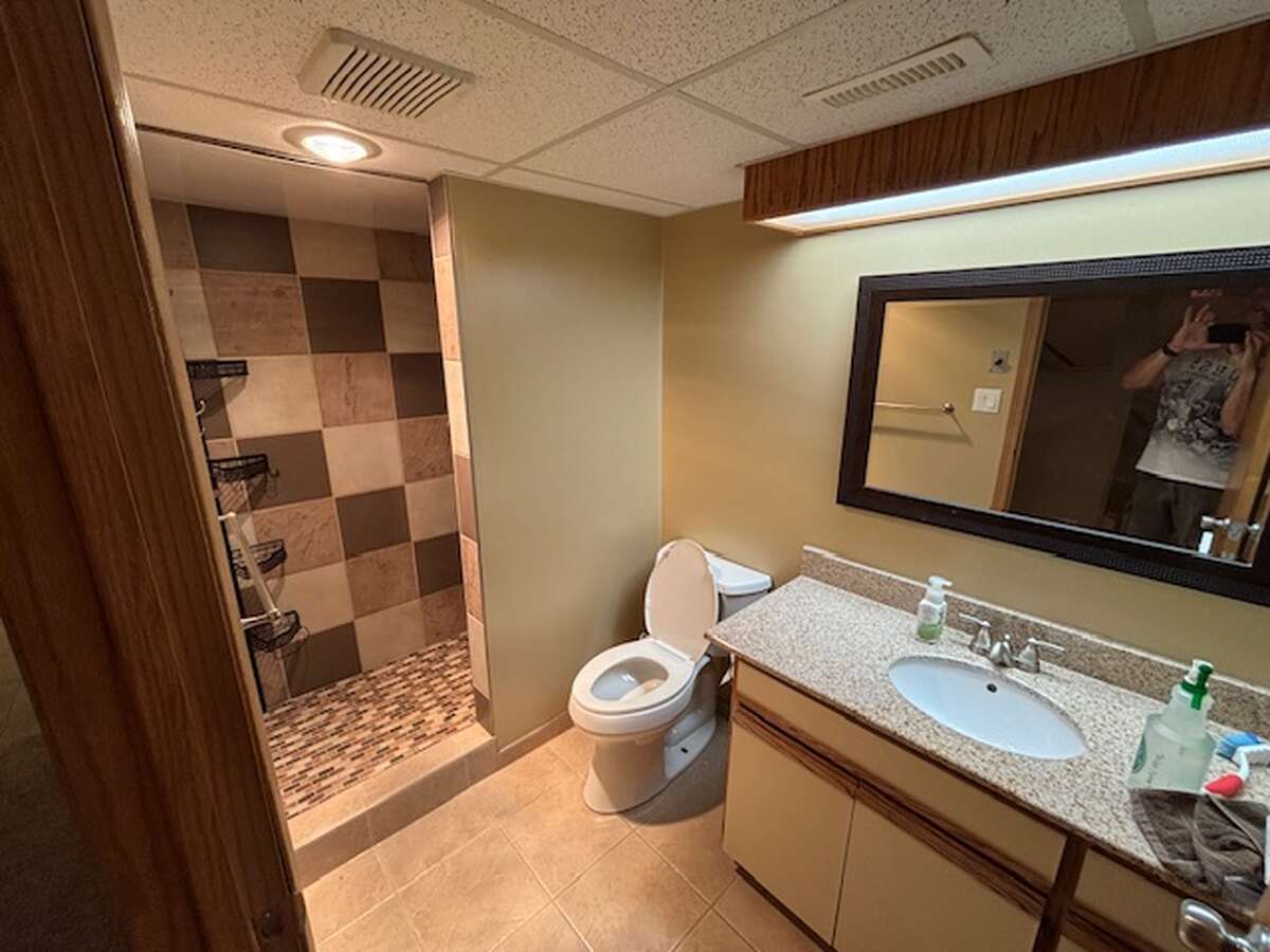 Downstairs bathroom with floor to ceiling tile