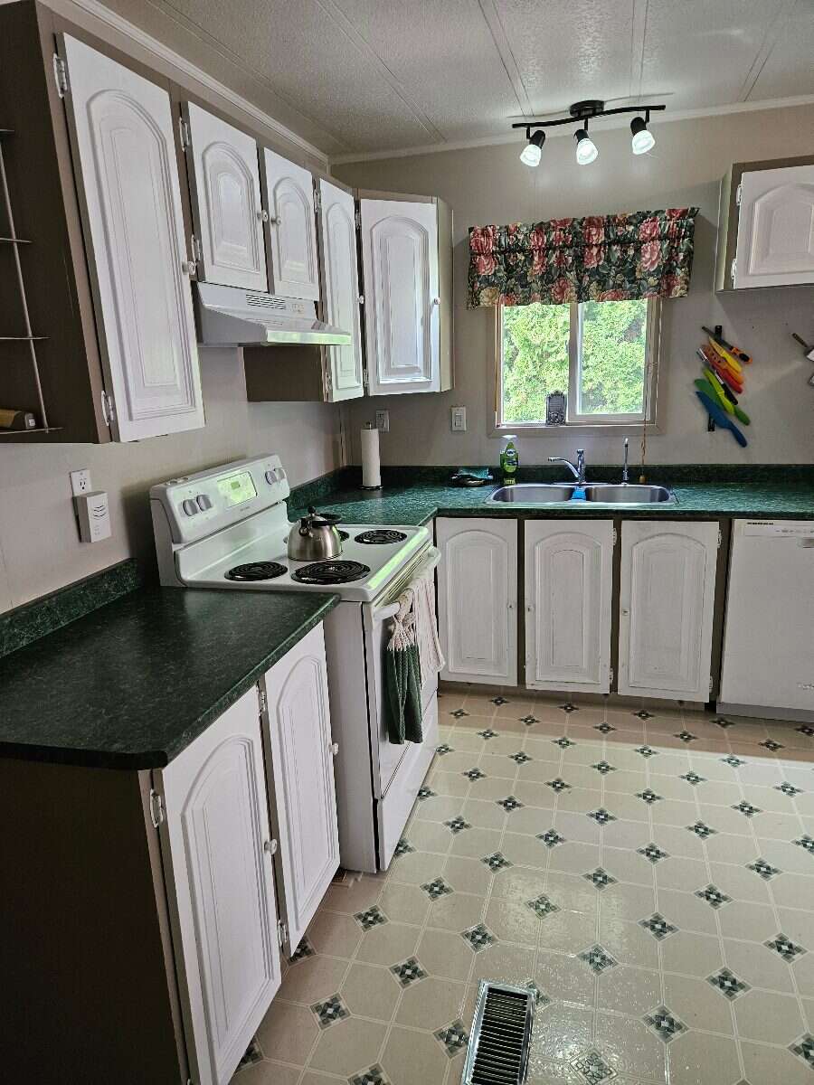  Security & Comfort in this Upgraded Mftd. Home