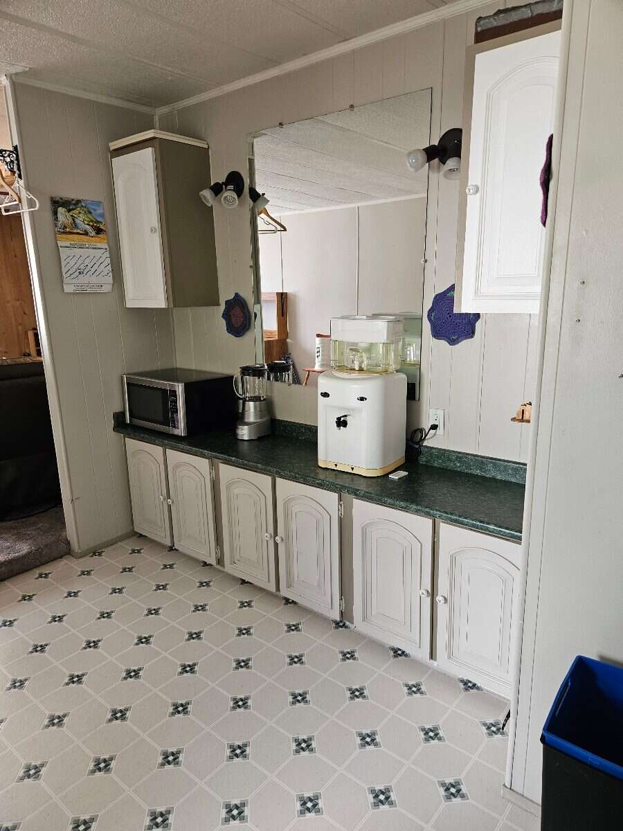  Security & Comfort in this Upgraded Mftd. Home