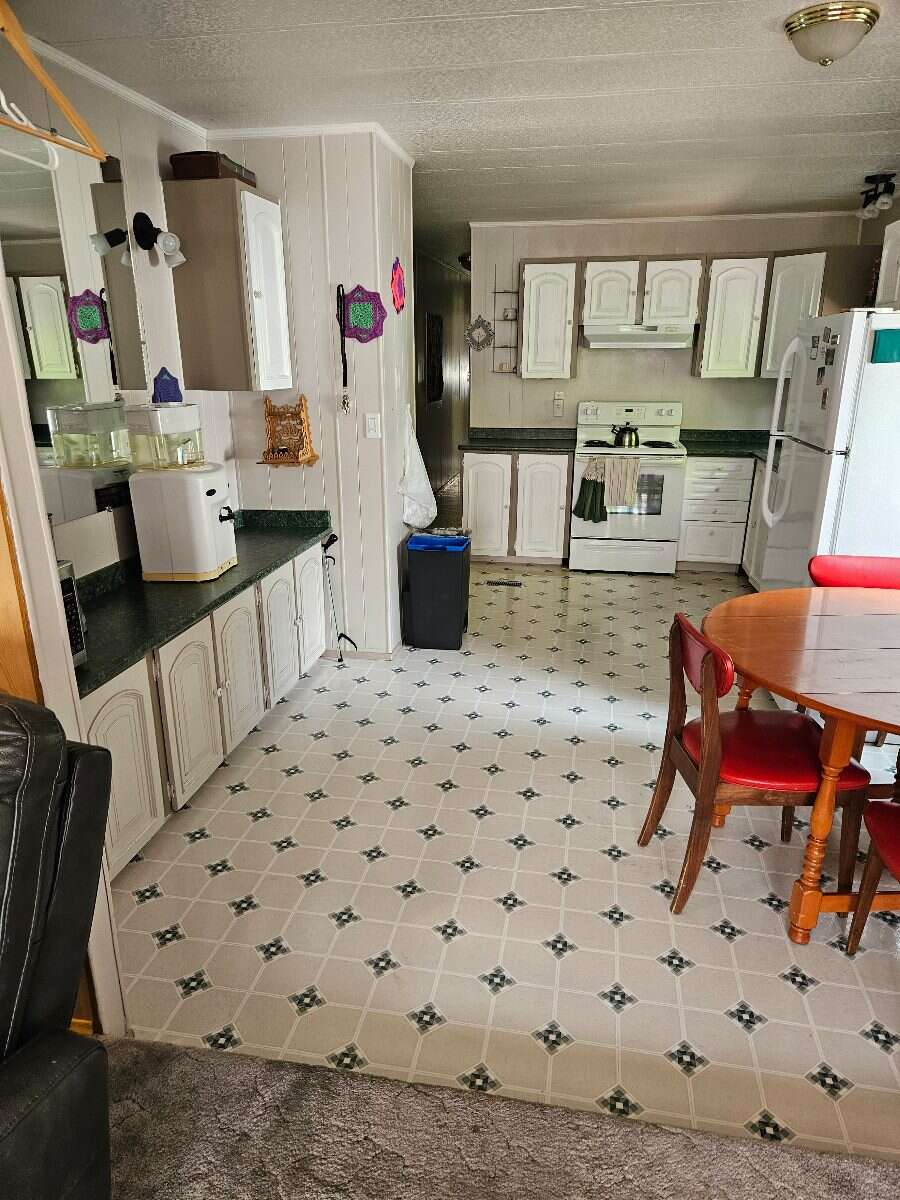  Security & Comfort in this Upgraded Mftd. Home