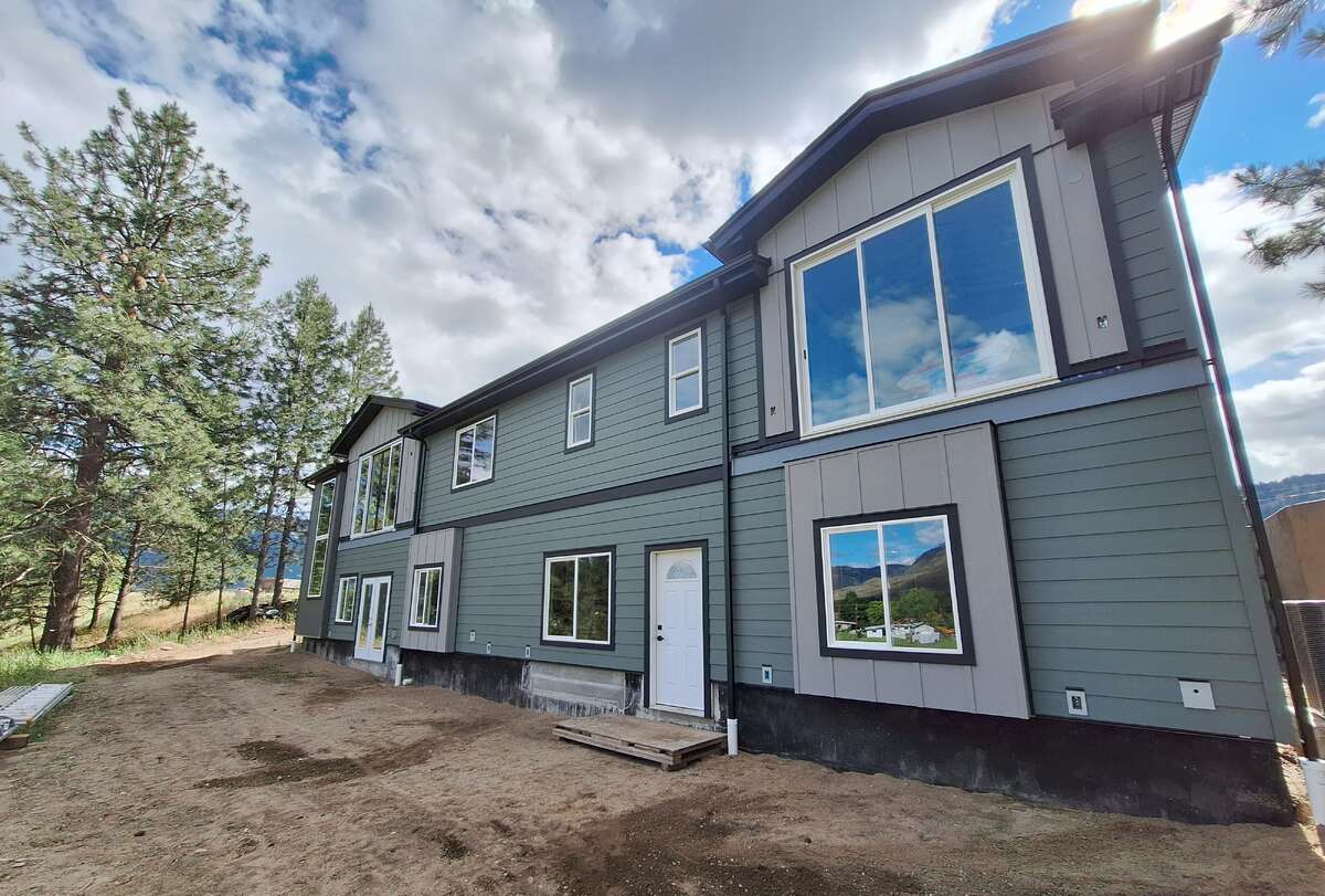 Rental suite private entrance in foreground, Main Residence rec room double doors at far end
