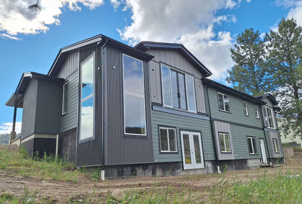 Rental suite private entrance in foreground, Main Residence rec room double doors at far end