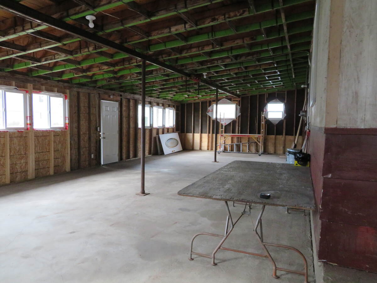 1133sf attached storage area on concrete slab. Roof was reinforced with banded strapping for future development of an upper deck. (Deck not completed)