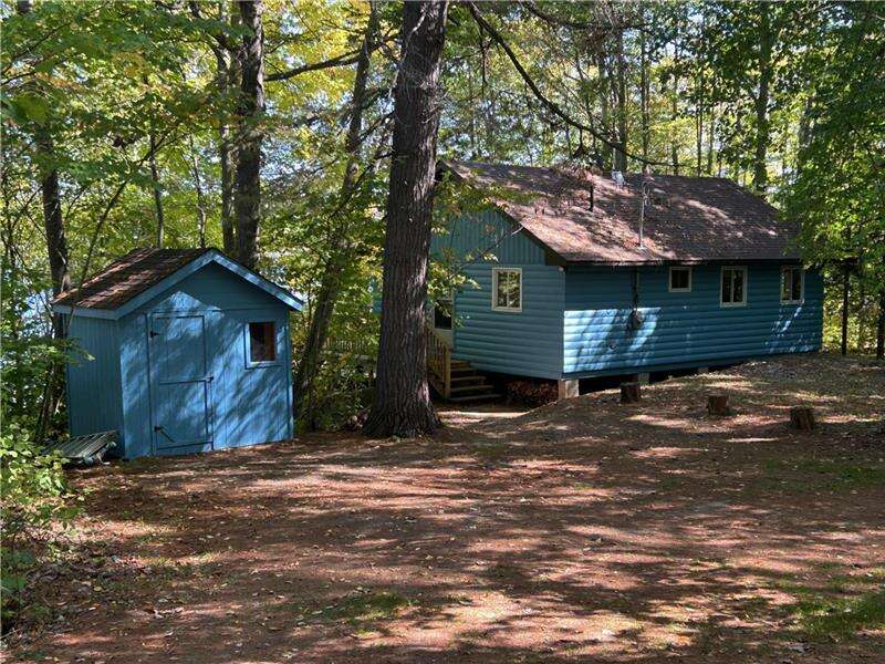 Back of the cottage and storage shed