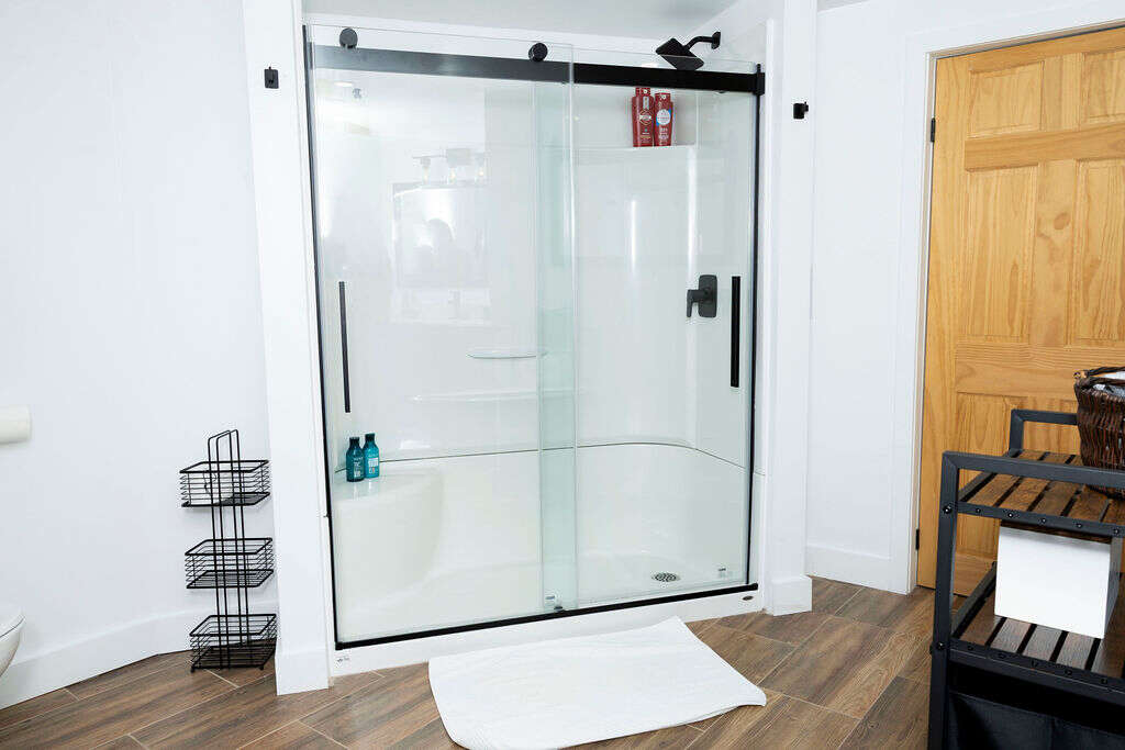 Newly installed 3 piece bath in basement with heated tile floor