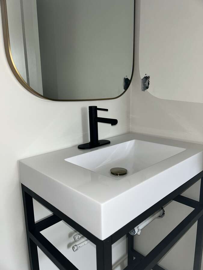 Main Floor Half Bath Sink and Mirror
