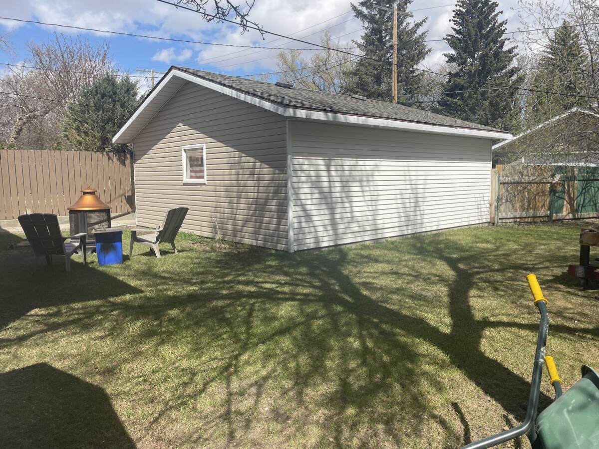 Back yard with fire/bbq pit, fruit trees, crabapple, great for making jam and jelly