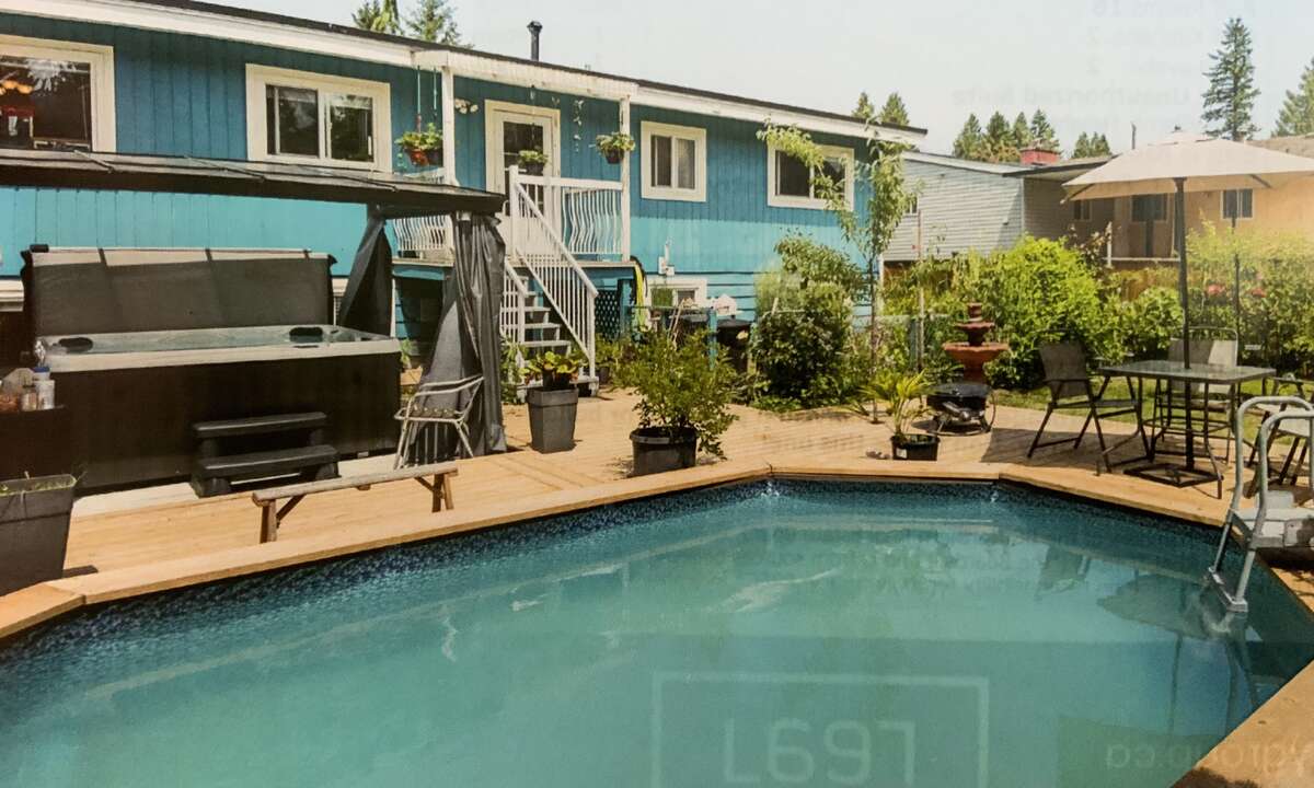 Big back yard with 14x18 pool with 30x24 deck, hot tub and large garden area, many fruit trees
