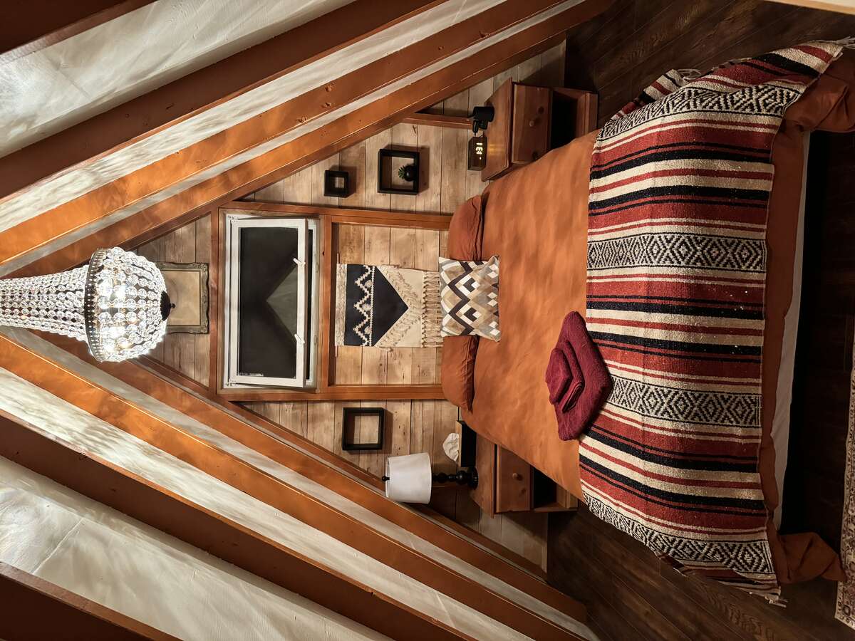 Cabin 4 Interior with Full Bed and Chandelier