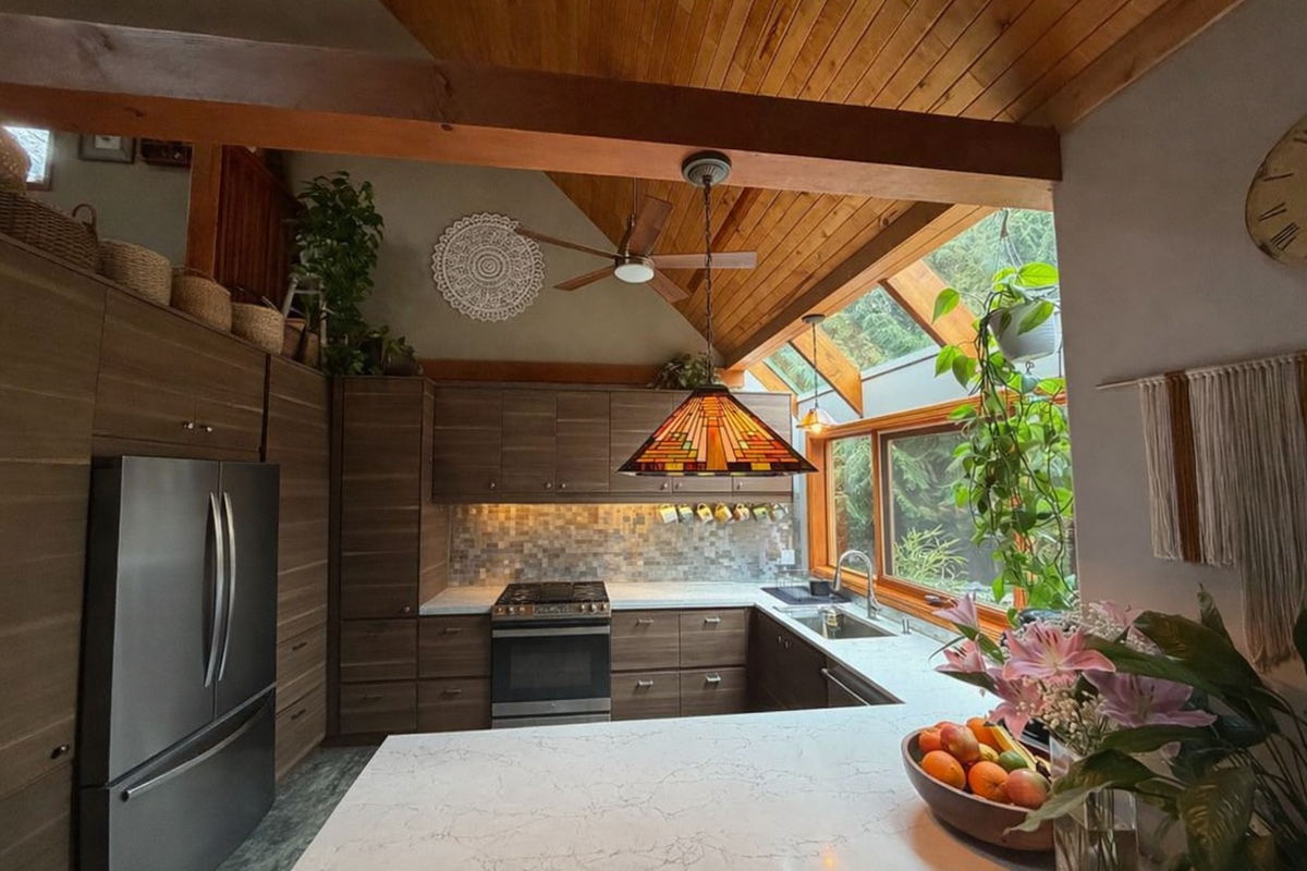 A Modern Kitchen filled with Natural Light, Expansive Windows, and Warm Wood Accents