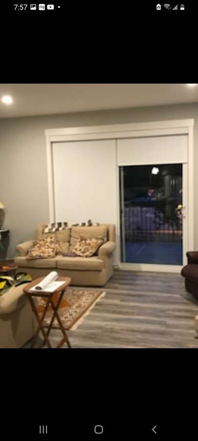 MAIN FLOOR LIVING ROOM WITH SLIDING DOOR TO BALCONY