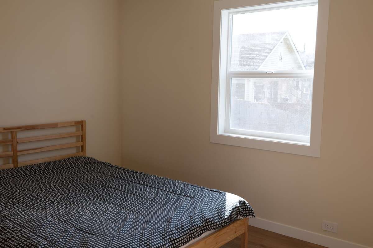 One of two bedrooms, alternate view, window overlooks back yard