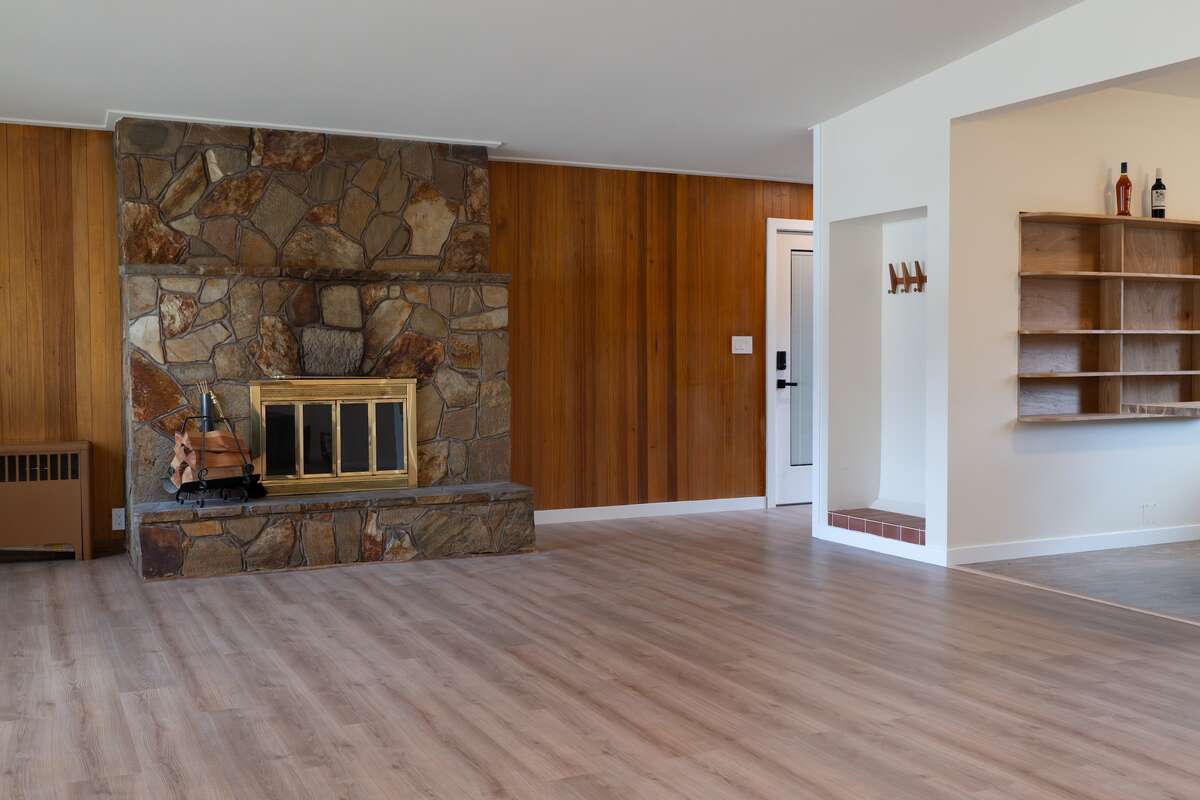 Open concept floorplan with wood burning fireplace