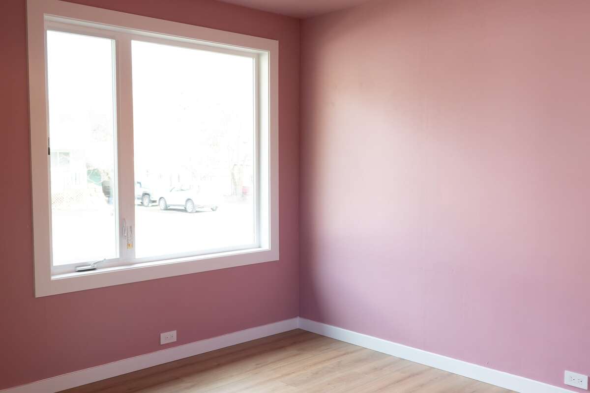 One of two bedrooms, alternate view, window overlooks front street