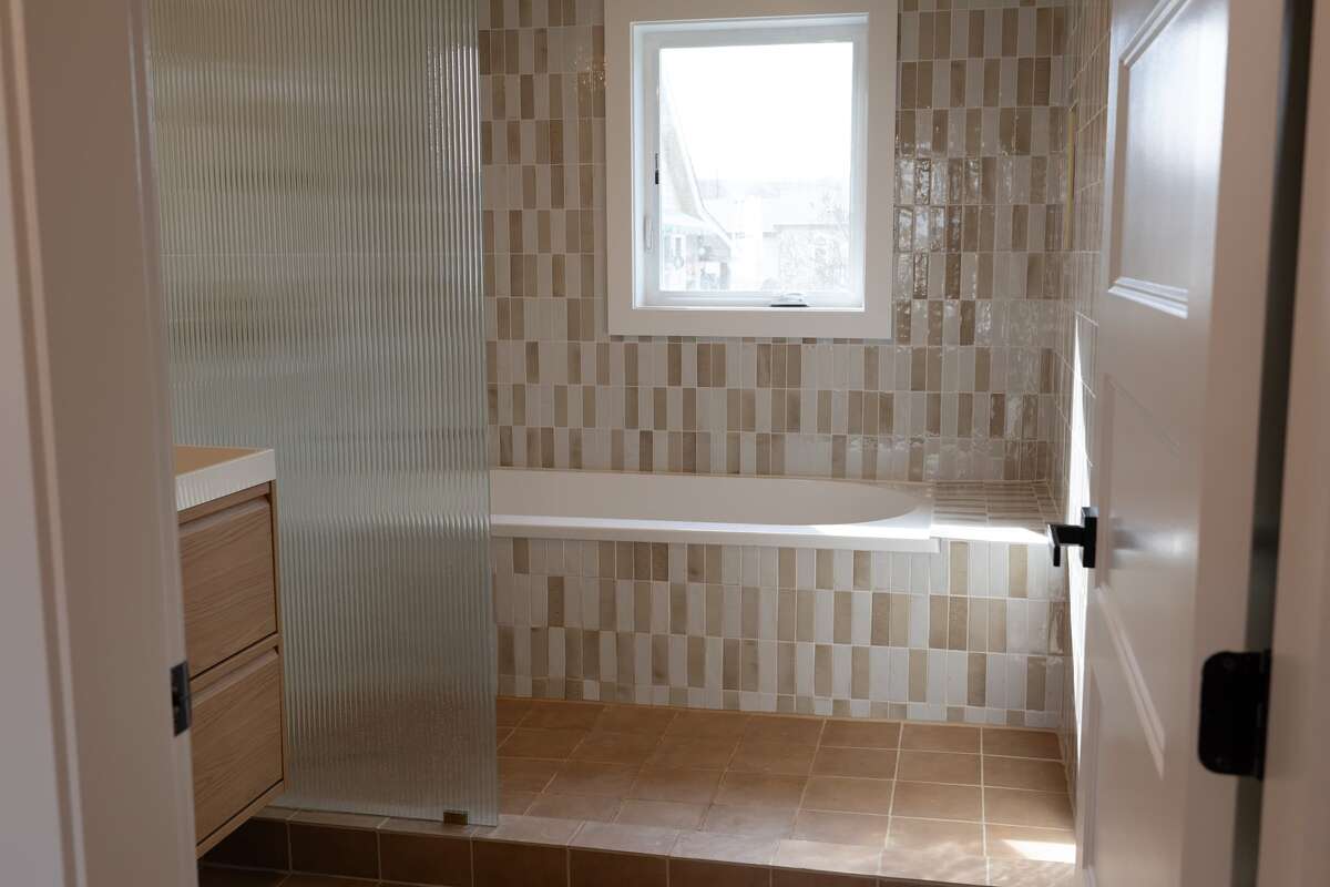 Oversized bathtub and walk-in shower area
