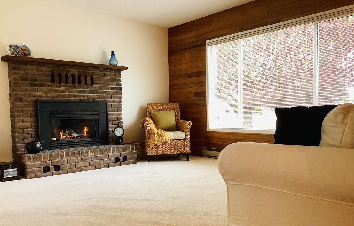 Original brick wood burning fireplace was converted to a convenient gas fireplace