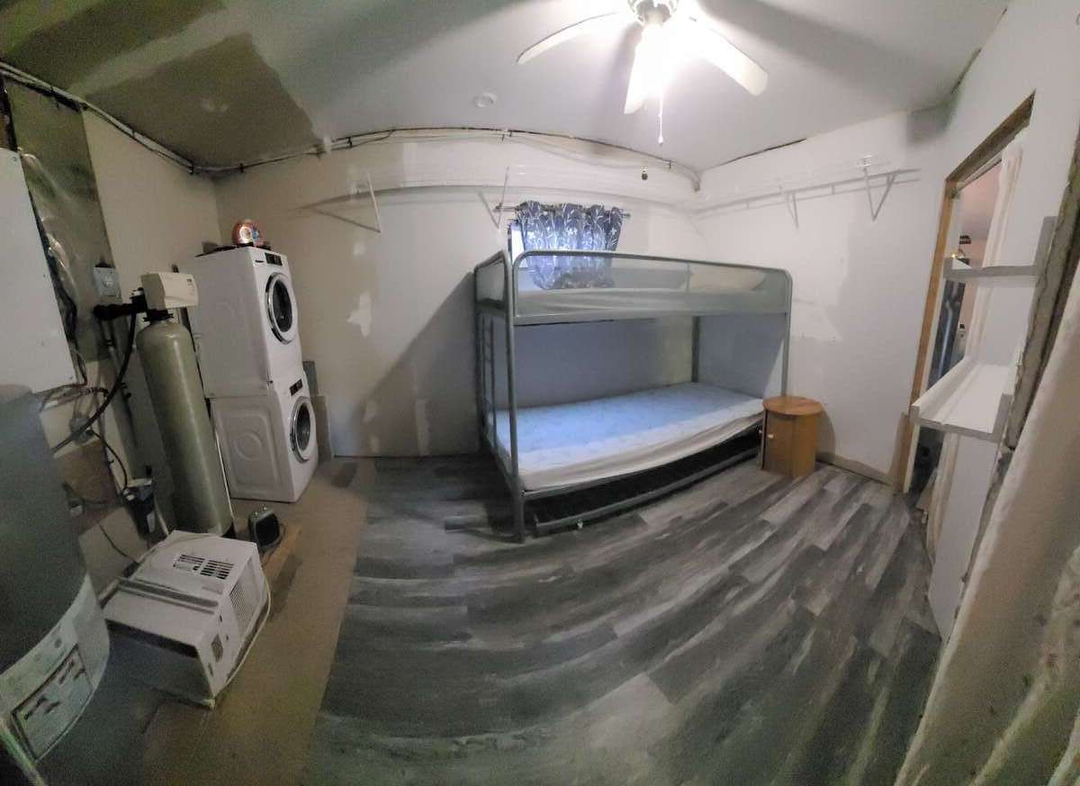 Utility room and second bedroom. Washer and dryer not included.