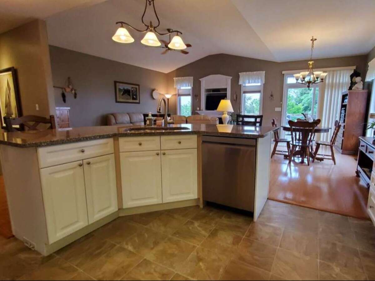 Privacy, Lake Views, & 3,000 sqft. Refined Living!